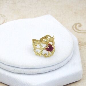Elegant Gold Ring with Red Gemstone